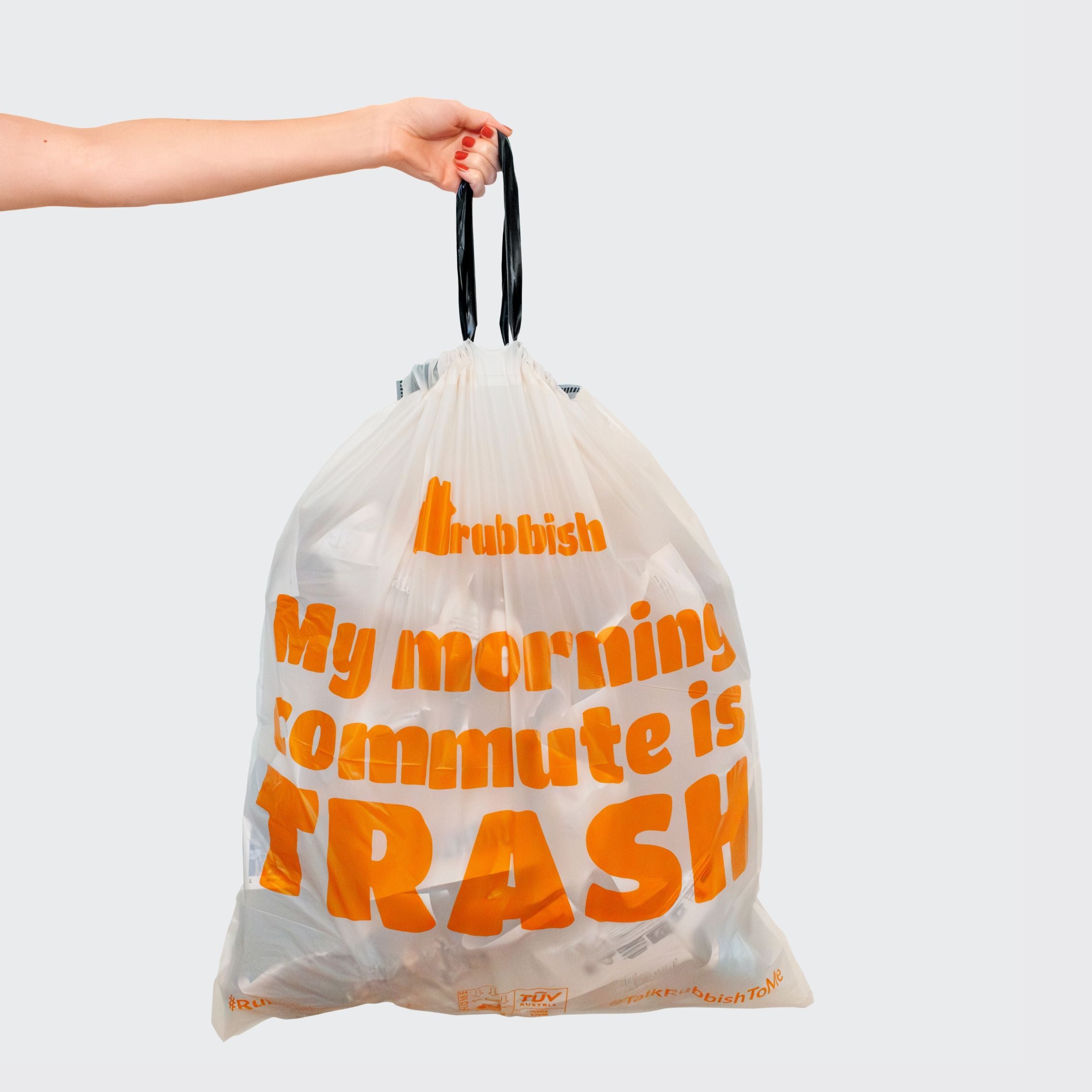 Rubbish Home trash bags -  woman holding bag with slogan